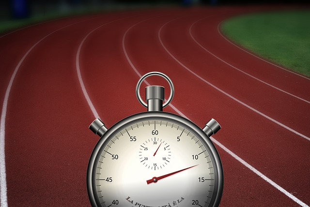 A picture of a race track, overlaid with a stop watch, showing the sense of urgency and the idea of competitive filing.
