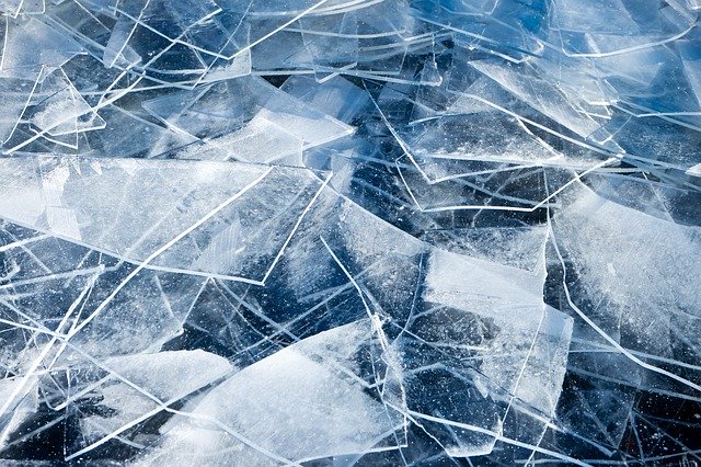A close up of a broken ice flow, with lots of jagged ice edges.
